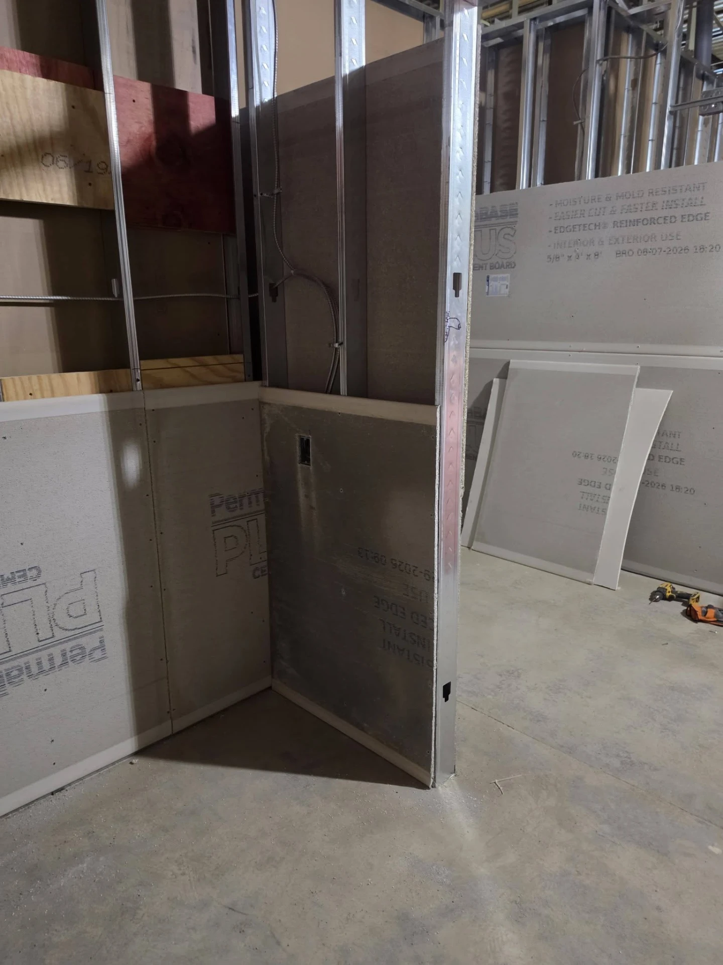 Metal framing and board installation during an interior project.