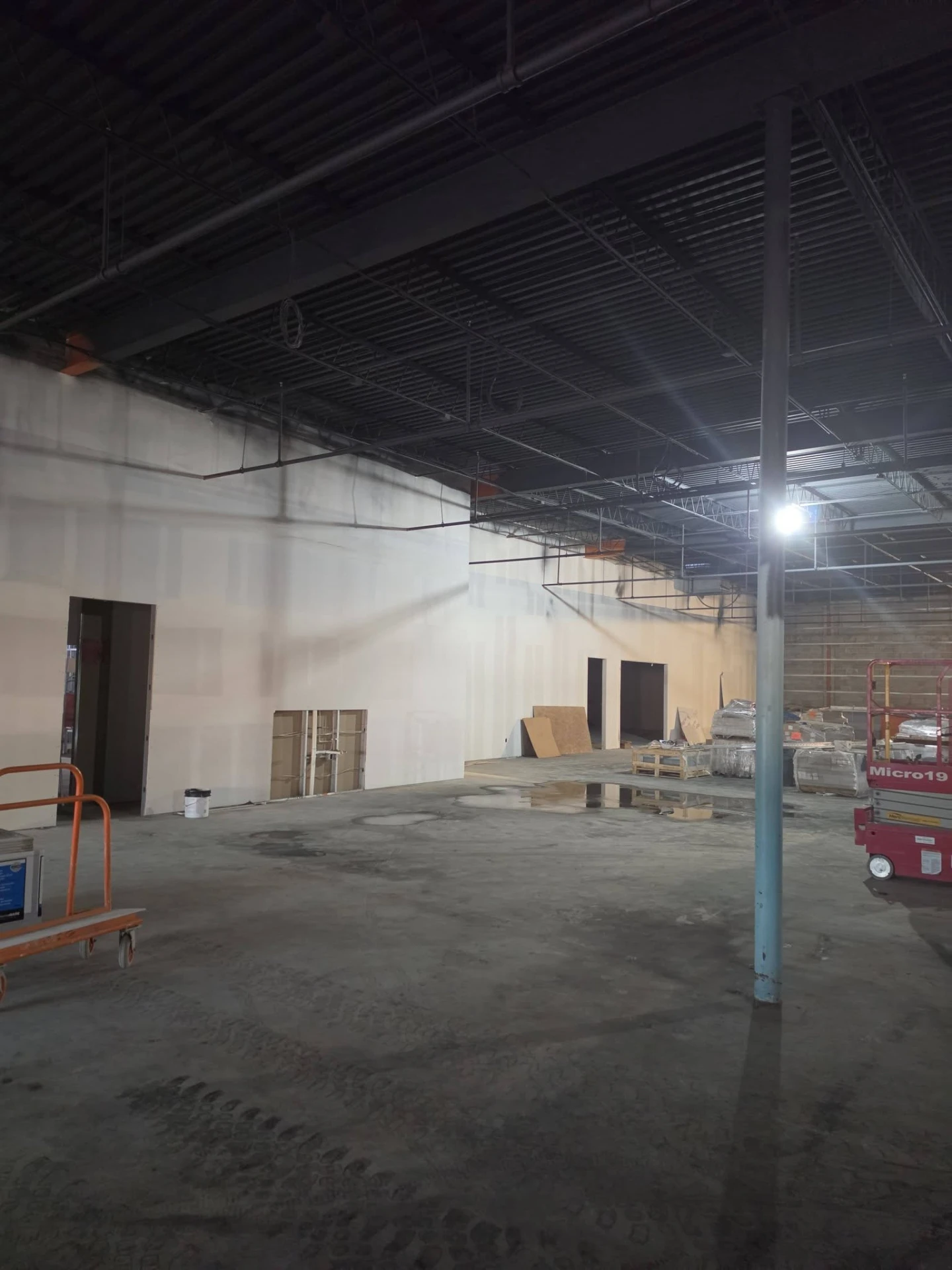 A wide view of interior wall work in progress.