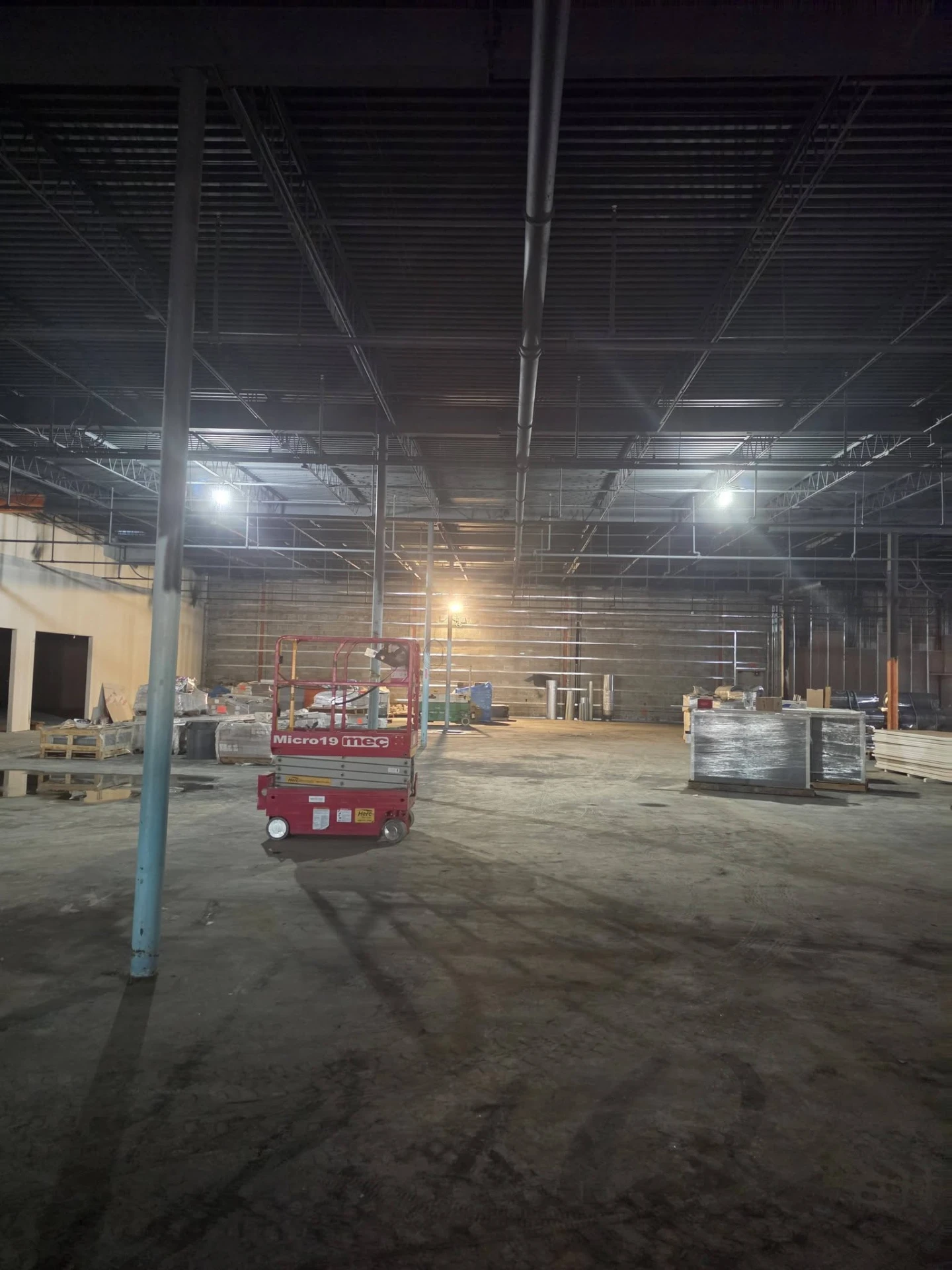 An interior worksite with equipment and materials in place.